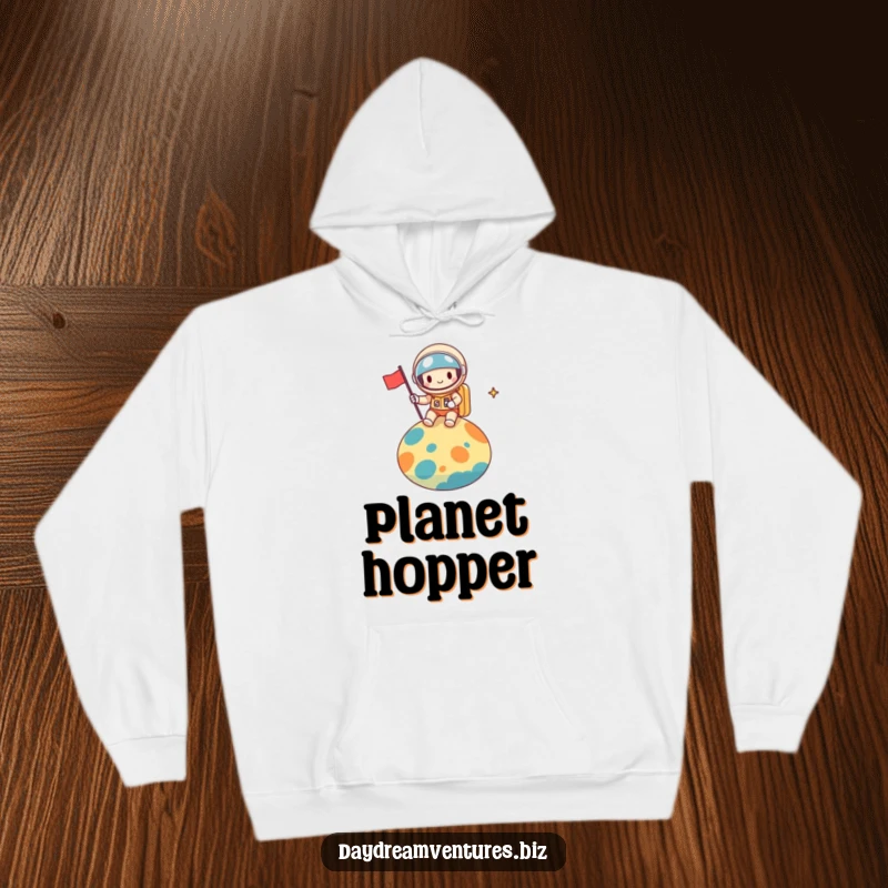 Funny space explorer hoodie, a cheerful character planting a flag on a colorful alien planet, cozy and adventurous, a funny gift.